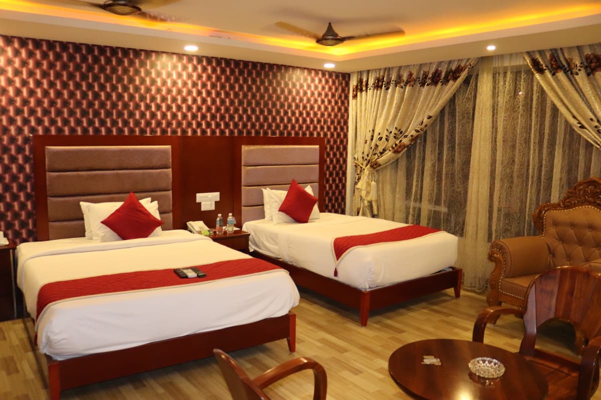 Park Queen room with two single beds and sheer patterned curtains